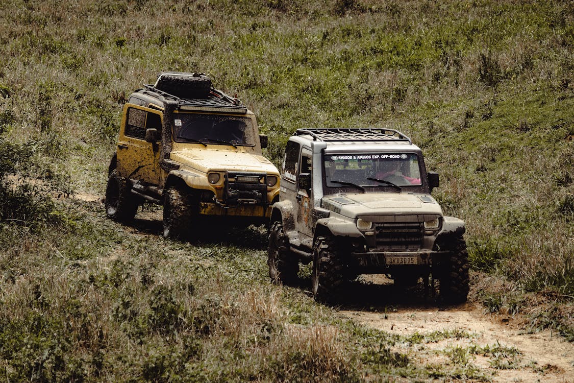 Overlanding vehicles on a rugged trail demonstrating the need for vehicle blast mitigation with polyurea coatings